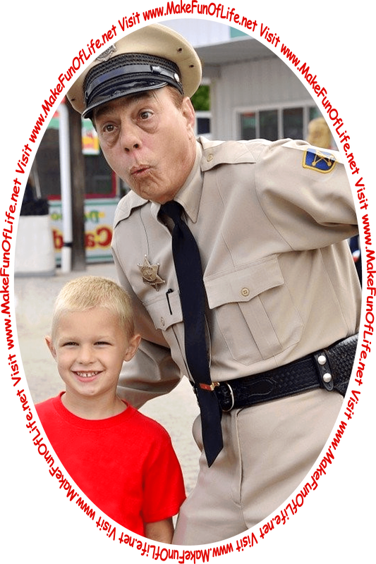 Picture of a happy smiling Barney Fife reenactor and a happy smiling boy at a Mayberry Fair, looking at the words and pictures on the website, and the words, ‘Visit www.MakeFunOfLife.net.’