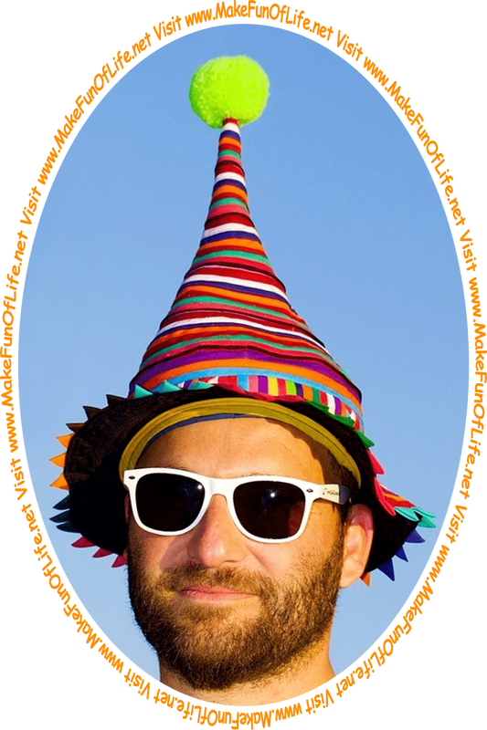 Picture of a man wearing a silly hat that is shaped like a cone, with a fluff ball on the top, and the words, ‘Visit www.MakeFunOfLife.net.’