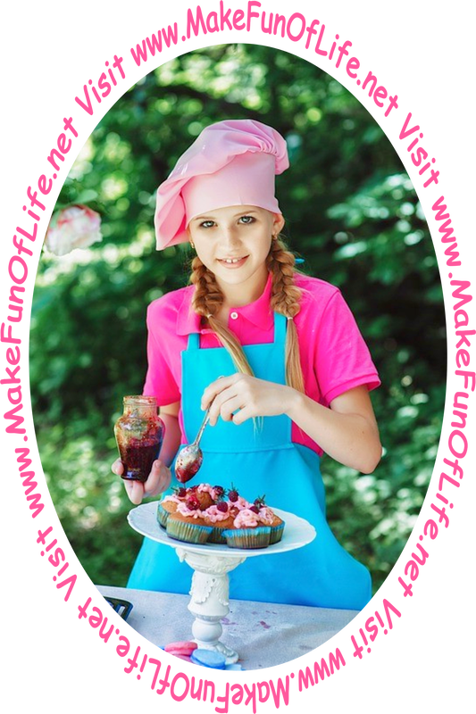 Picture of a happy smiling young lady standing at a table under a tree as she puts toppings onto cupcakes.