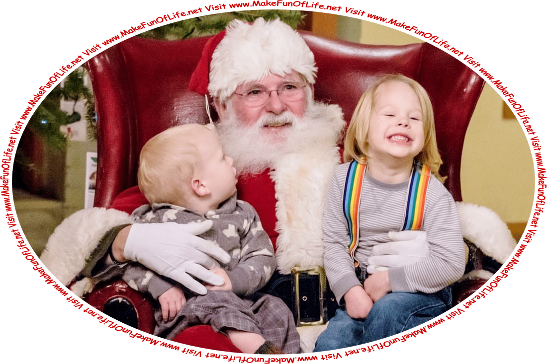 Picture of Santa Claus with two children sitting in his lap, and the words, ‘Visit www.MakeFunOfLife.net.’