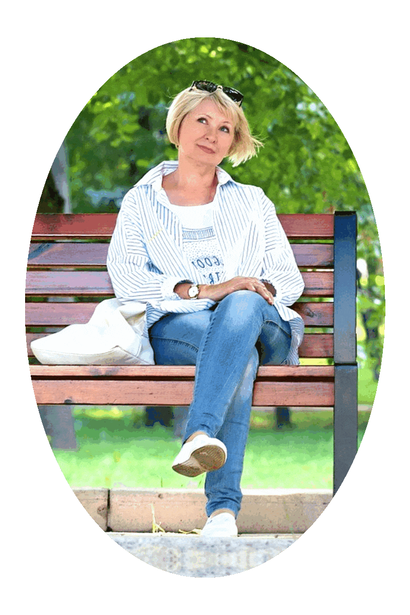 Picture of a woman sitting on a park bench.