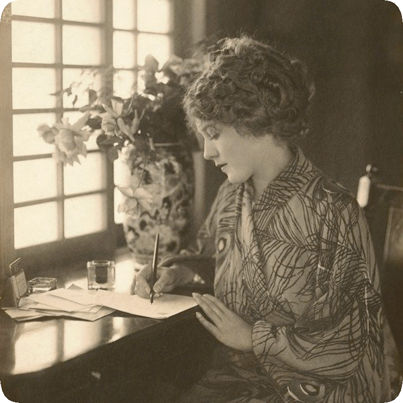 Picture of actress Mary Pickford writing a letter.