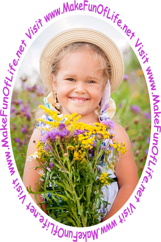 Picture of a happy smiling girl holding a bouquet of freshly cut flowers with yellow and lavender blossoms.