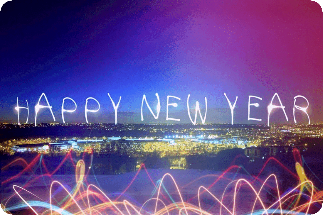 Nighttime picture of a city and the words, ‘Happy New Year.’