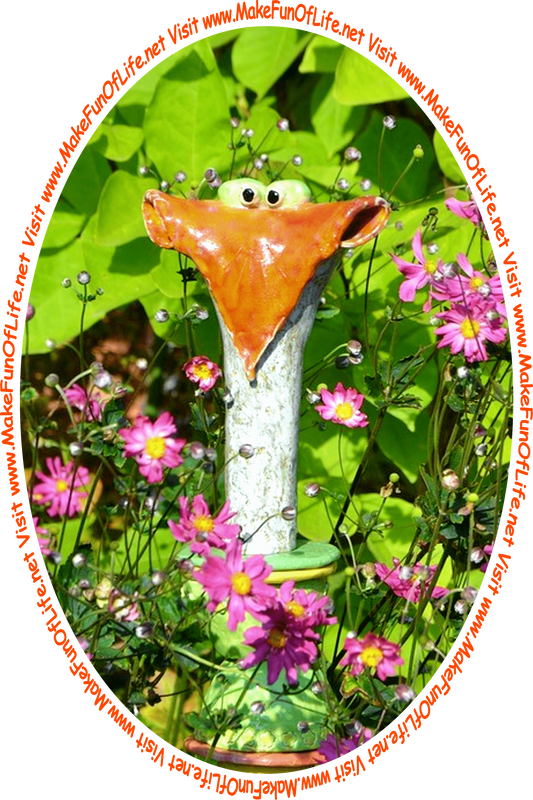 Picture of the head and neck of a whimsical metal sculpture goose that is surrounded by green leafy flowering plants with lavender-pink blossoms in a garden, and the words, ‘Visit www.MakeFunOfLife.net.’