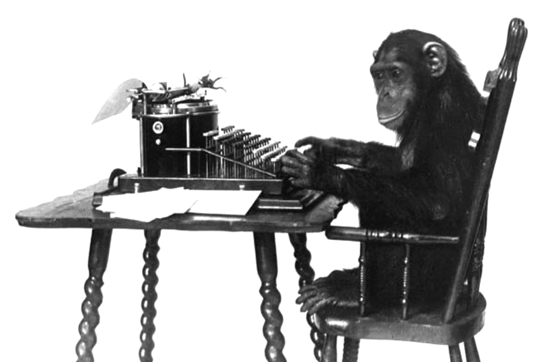 Picture of a happy smiling monkey sitting in a chair and working at a typewriter.