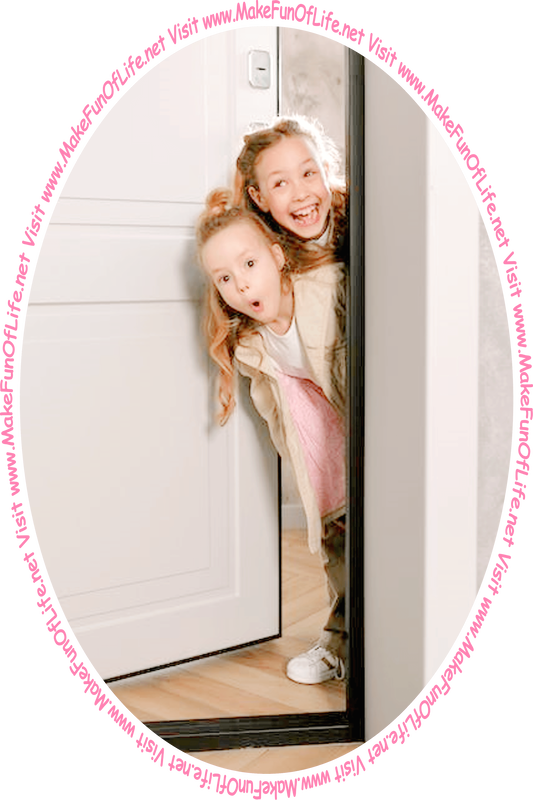 Picture of two happy smiling girls peering out from behing a partially open door.