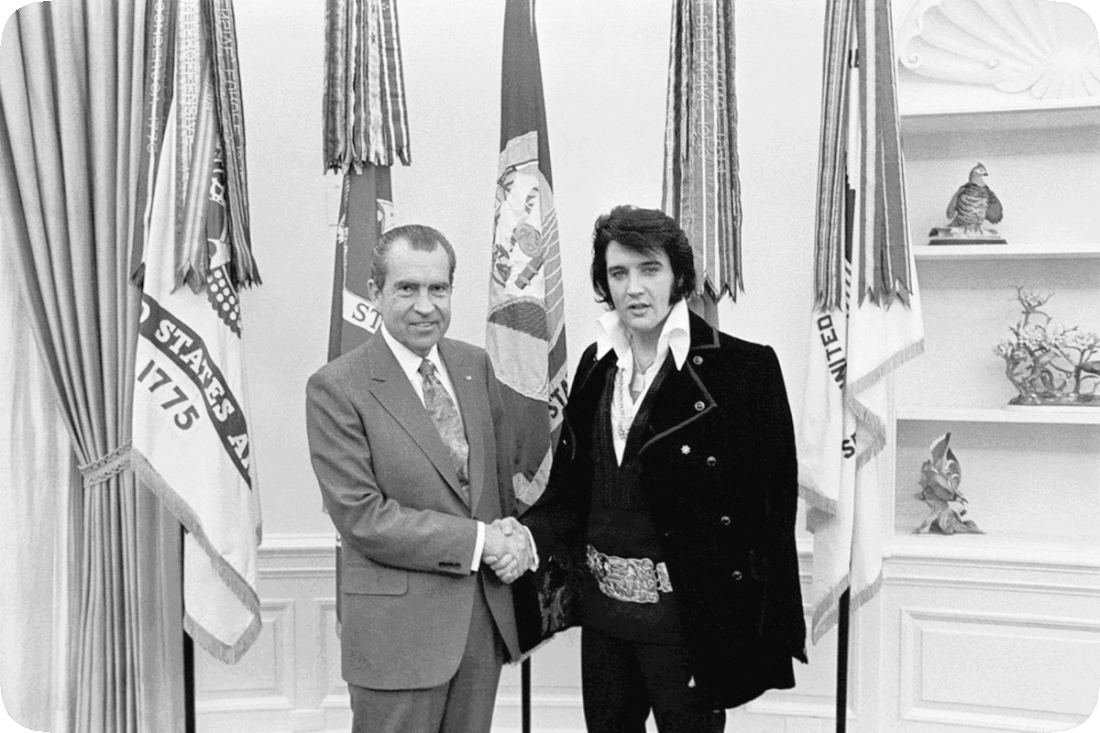 Picture of a happy smiling Richard Milhous Nixon and Elvis Aron Presley shaking hands at the White House.