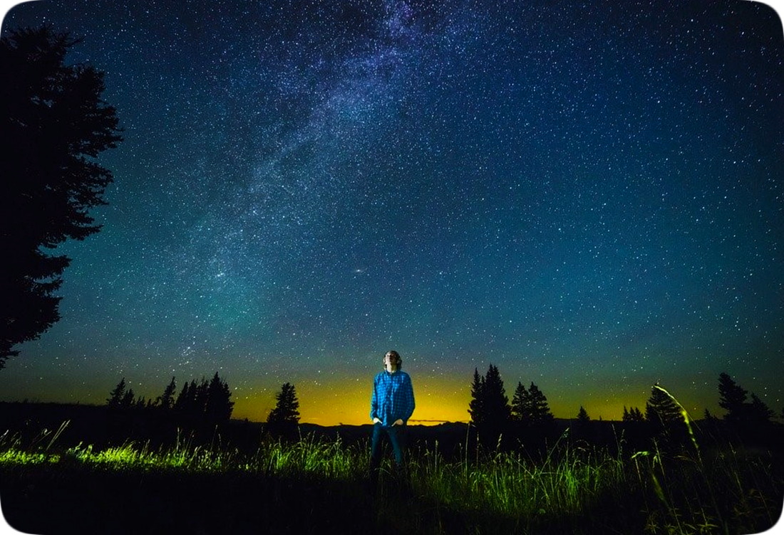Picture of a boy looking up at the stars