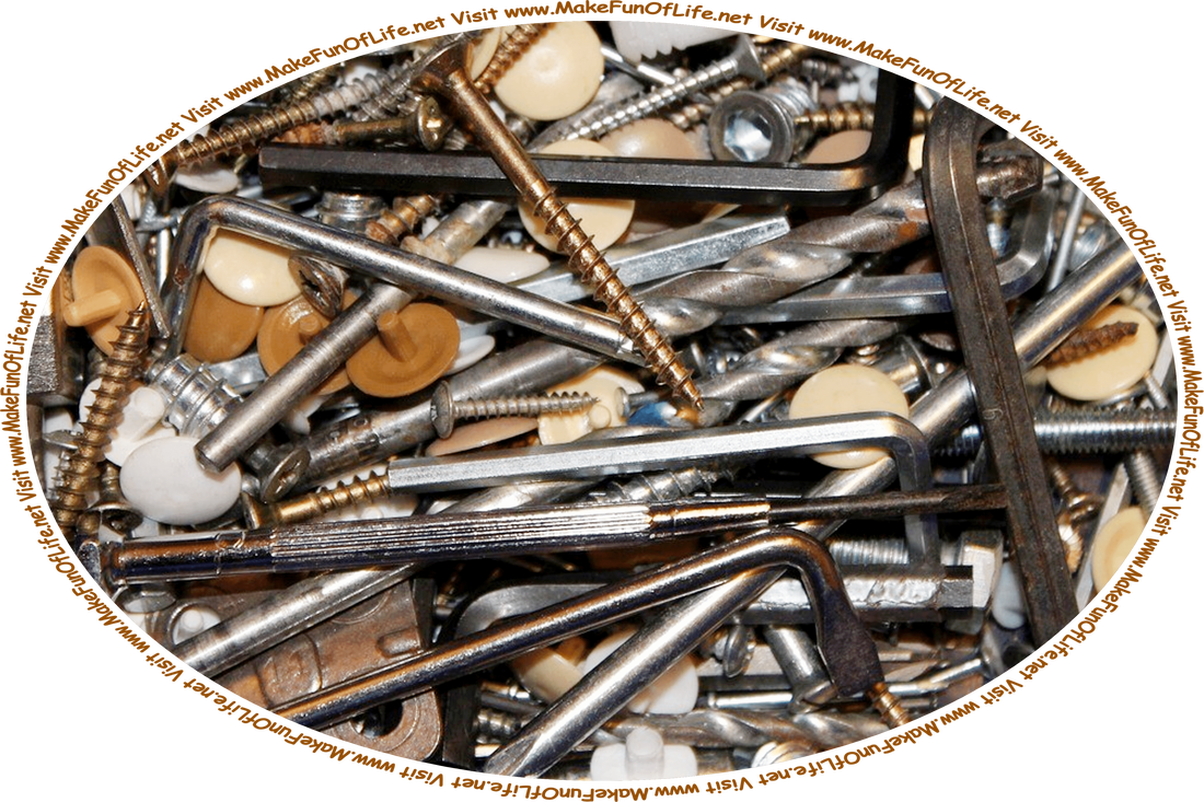 Picture of a jumble of leftover metal and plastic parts and small tools that might typically accompany products requiring some assembly, and the words, ‘Visit www.MakeFunOfLife.net.’