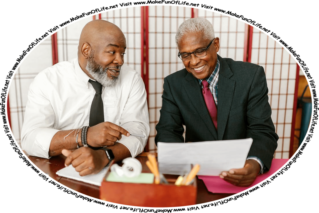Picture of two happy smiling men sitting at a table, going over paperwork together, and the words, ‘Visit www.MakeFunOfLife.net.’