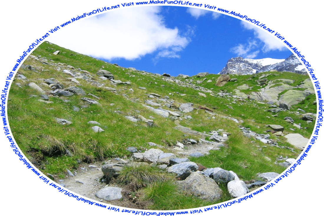 Picture of a rock-strewn dirt footpath leading up a hillside that is covered with green grass, a blue sky with fluffy white clouds above, and the words, ‘Visit www.MakeFunOfLife.net.’