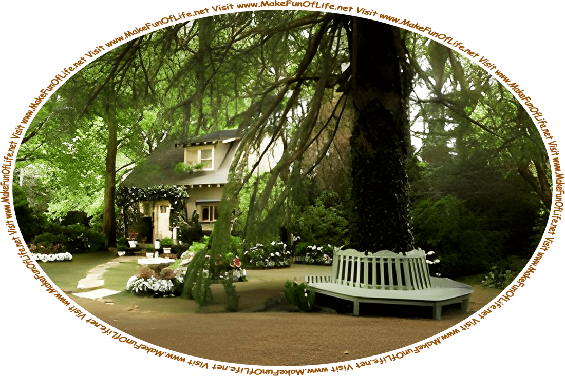 Picture of a small house with a walkway through a lawn of green grass and flowering plants, a bench wrapped around the trunk of a tree, more shade trees around the house, and the words, ‘Visit www.MakeFunOfLife.net.’