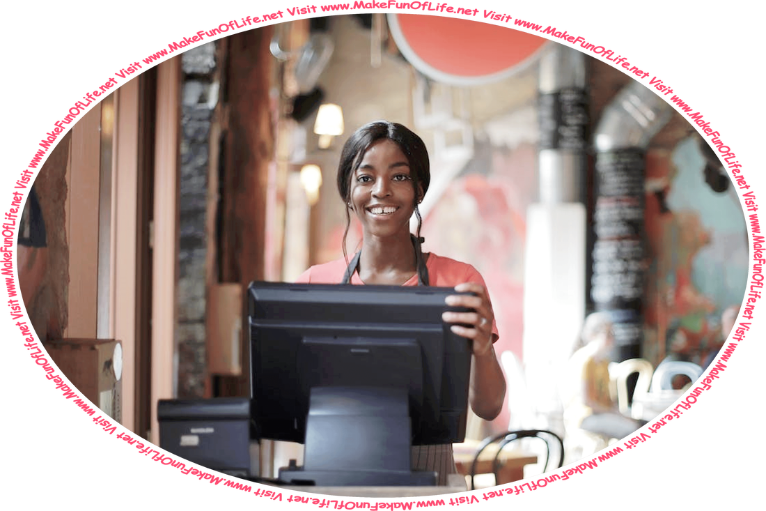 Picture of a happy smiling young woman working behind a cash register in a shop, and the words, ‘Visit www.MakeFunOfLife.net.’
