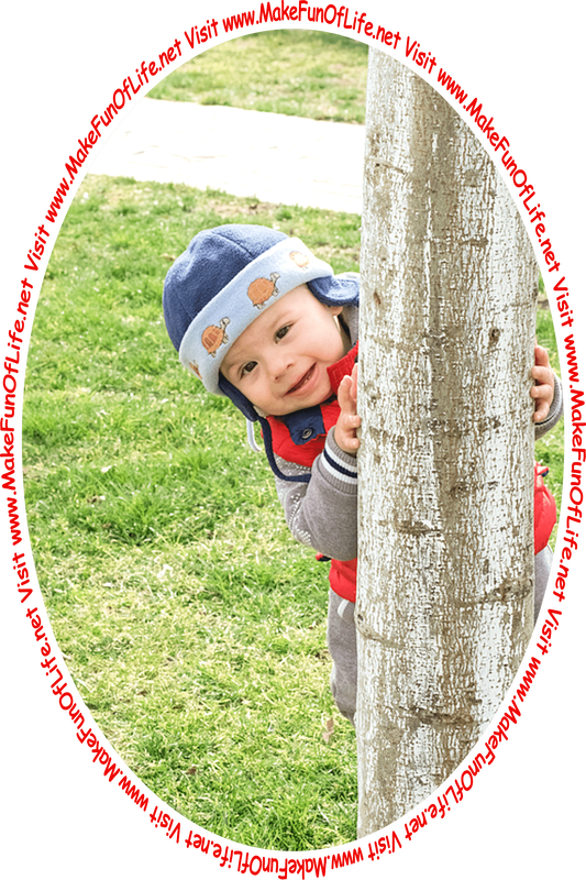 Picture of a happy smiling toddler peeking out from behind a tree and the words, 'Visit www.MakeFunOfLife.net.'
