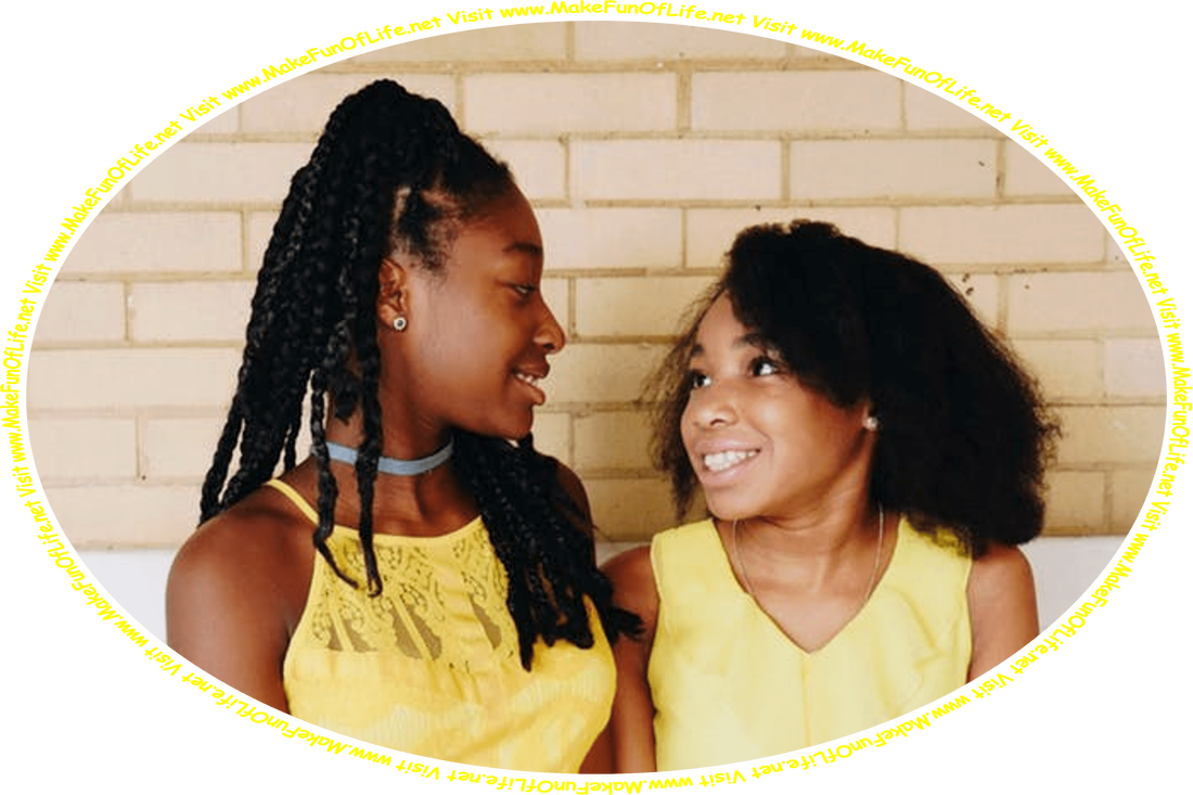 Picture of two happy smiling girls, who are friends, sitting on a wooden bench and talking, and the words, ‘Visit www.MakeFunOfLife.net.’